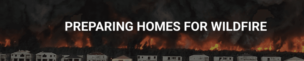 Preparing homes for wildfire: houses silhouetted against an approaching fire front.